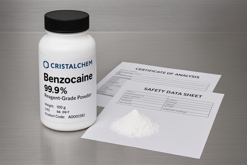 CristalChem Benzocaine 99.9% reagent-grade powder with COA and SDS documents on stainless steel laboratory background — Benzocaine Market Outlook 2026
